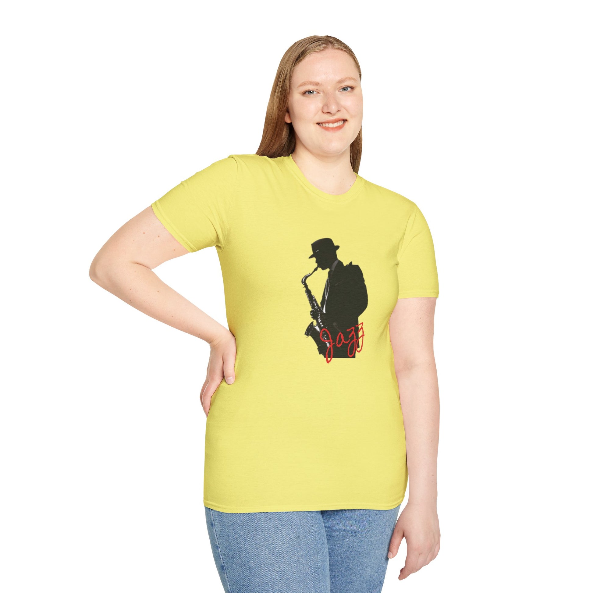 The Saxophonist - KC Jazz Inspired T-Shirt by KC Inspirations is a blue t-shirt featuring a black silhouette of a saxophonist wearing a hat, with the word "Jazz" written in white cursive text below the image. Perfect for music lovers and fans of Kansas City Jazz.