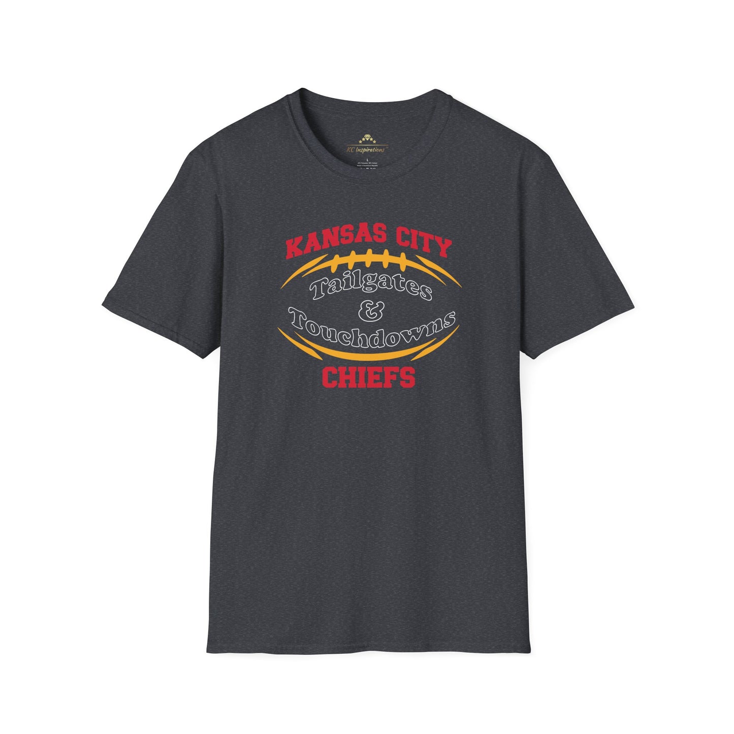 A dark gray Kansas City Chiefs t-shirt with "Kansas City Tailgates & Touchdowns Chiefs" written in bold red and yellow letters. The text is designed within the outline of a football, with "Chiefs" prominently featured at the bottom—perfect game day attire to show your team spirit. This is the **Tailgates & Touchdowns - Kansas City Chiefs Inspired T-Shirt** by **KC Inspirations**.