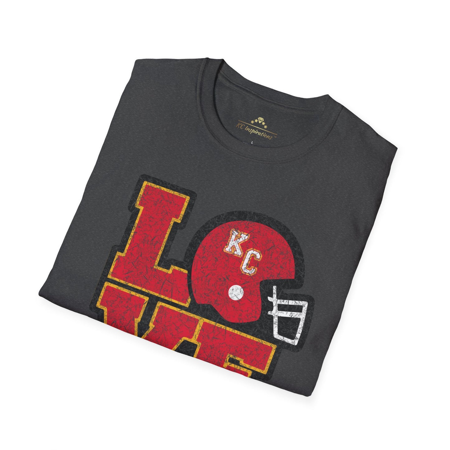 Introducing the LOVE KC - Distressed - Kansas City Chiefs Inspired T-Shirt by KC Inspirations: a dark gray vintage tee showcasing a unique graphic design featuring the word "LOVE" in red and gold. The "O" is cleverly replaced with a red football helmet adorned with the initials "KC" in yellow, making it perfect gear for any Kansas City Chiefs fan.