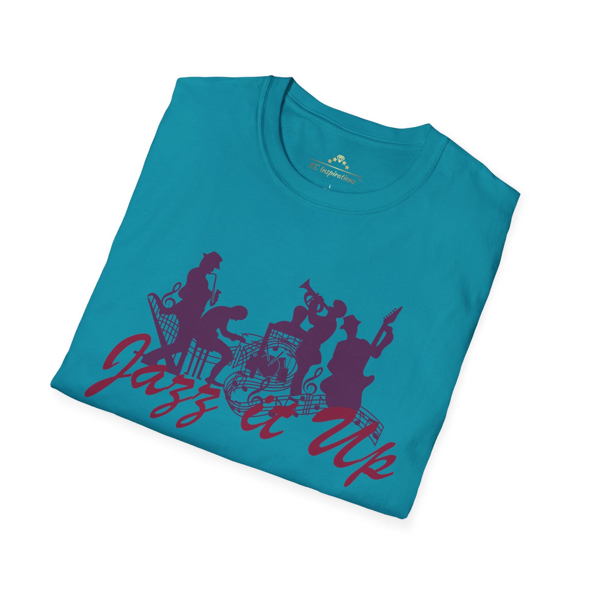 Teal-colored t-shirt featuring the silhouette of jazz musicians and dancers in purple. The text "Jazz it Up" is prominently displayed in stylish purple lettering underneath the silhouettes, making this KC Inspirations Jazz It Up - K.C. Jazz Inspired T-Shirt a tribute to the vibrant KC Jazz scene.