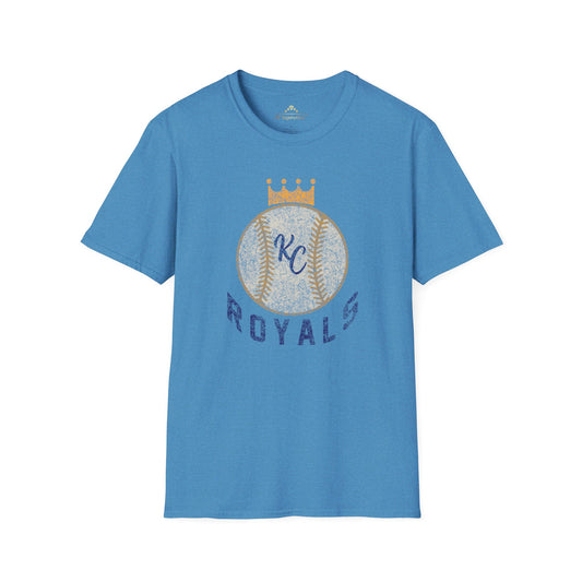 Light blue vintage Crown Baseball - Kansas City Royals Inspired T-Shirt featuring a graphic of a baseball with a crown on top. The letters "KC" are written in the center of the ball, and "Royals" is written in bold, navy blue text below the baseball graphic—a perfect tribute for Kansas City Royals fandom by KC Inspirations.