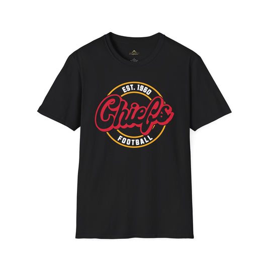 The Chiefs Football Medallion - Kansas City Chiefs Inspired T-Shirt by KC Inspirations is a black, soft-style tee that proudly displays the word "Chiefs" in red cursive letters within a yellow circle outlined in white. Additionally, it features "EST. 1960" and "FOOTBALL" written in white around the circle, capturing the Kansas City Chiefs spirit perfectly.