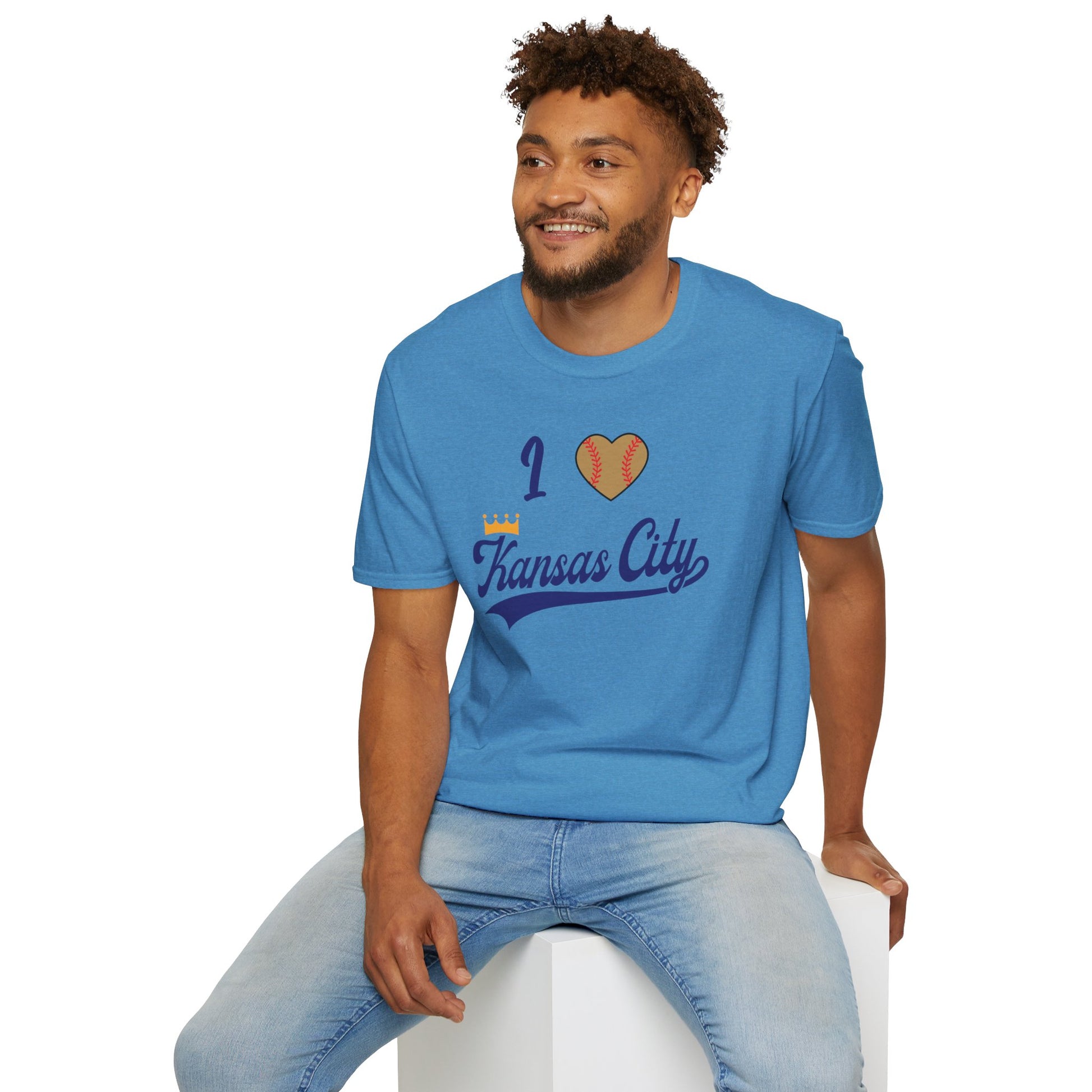 A light gray "I Heart Kansas City - Kansas City Royals Inspired T-Shirt" by KC Inspirations showcases team spirit with the text "I (heart) Kansas City" in blue script, where the heart is designed to resemble a baseball. Positioned across the chest, this Kansas City Royals-inspired design lays flat against a white background.