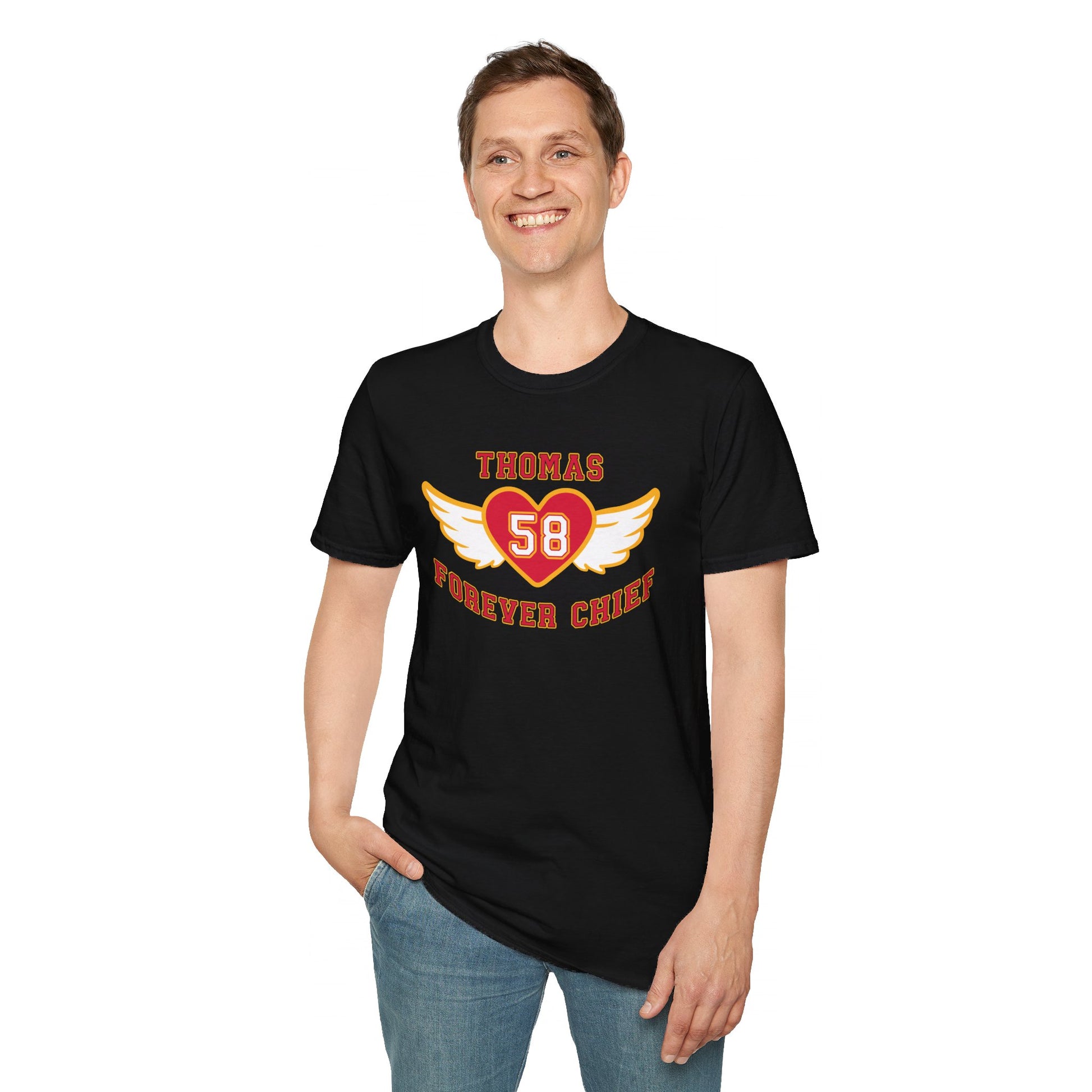 caucasian male smiling and wearing a black t-shirt with graphics of a heart with angel wings that say thomas forever chief with a number 58 inside the heart