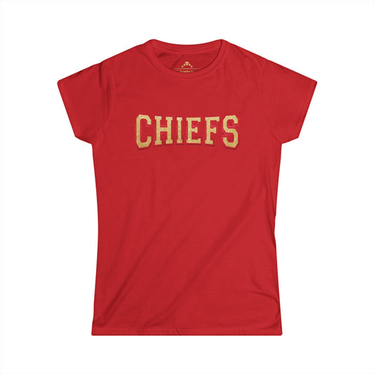 A red short-sleeve T-shirt with the word "CHIEFS" printed in large, bold, gold letters across the chest. Perfect for any fan collection, this Gold Glitter Chiefs - Kansas City Chiefs Inspired Women's T-Shirt by KC Inspirations is displayed against a plain, white background.