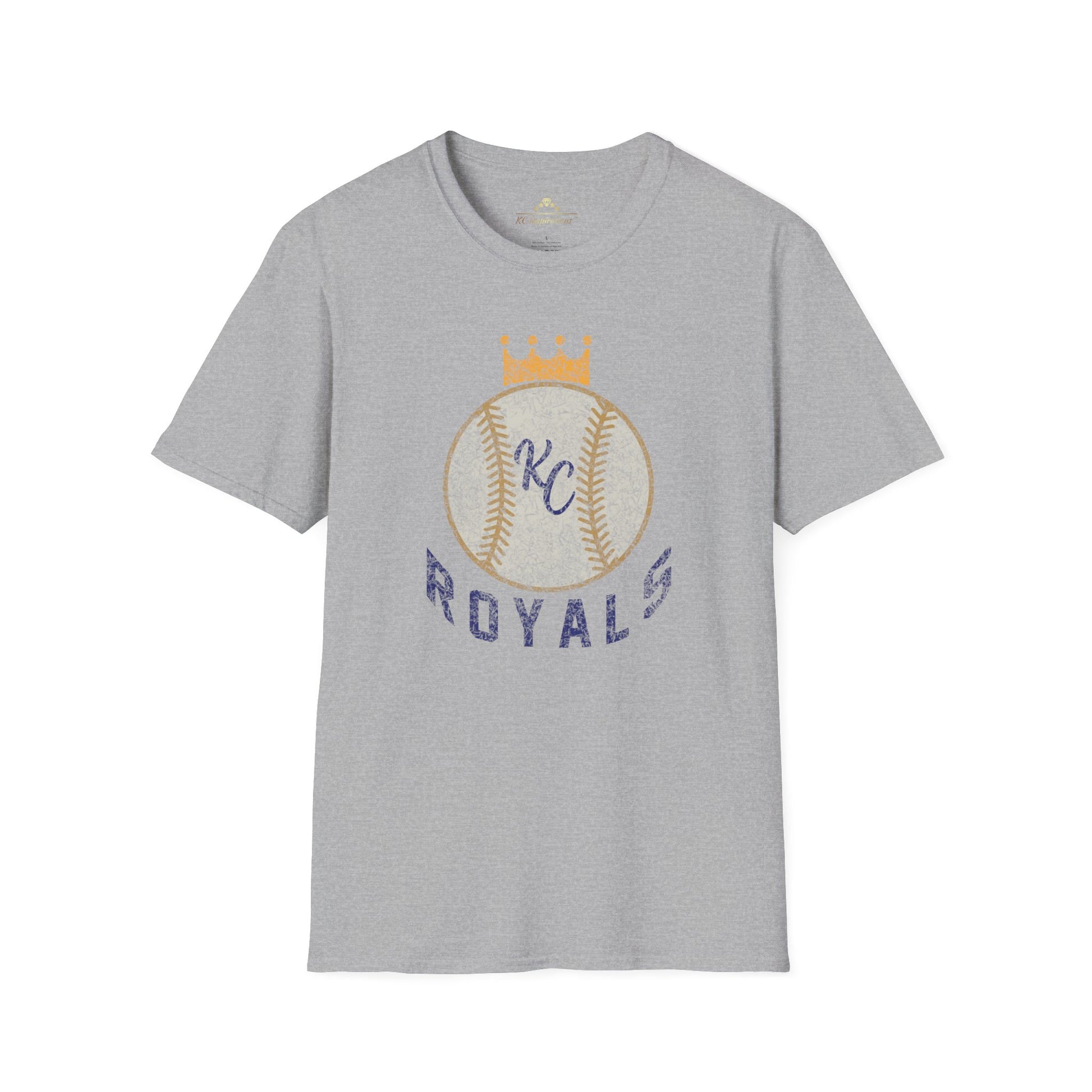 Light blue vintage Crown Baseball - Kansas City Royals Inspired T-Shirt featuring a graphic of a baseball with a crown on top. The letters "KC" are written in the center of the ball, and "Royals" is written in bold, navy blue text below the baseball graphic—a perfect tribute for Kansas City Royals fandom by KC Inspirations.