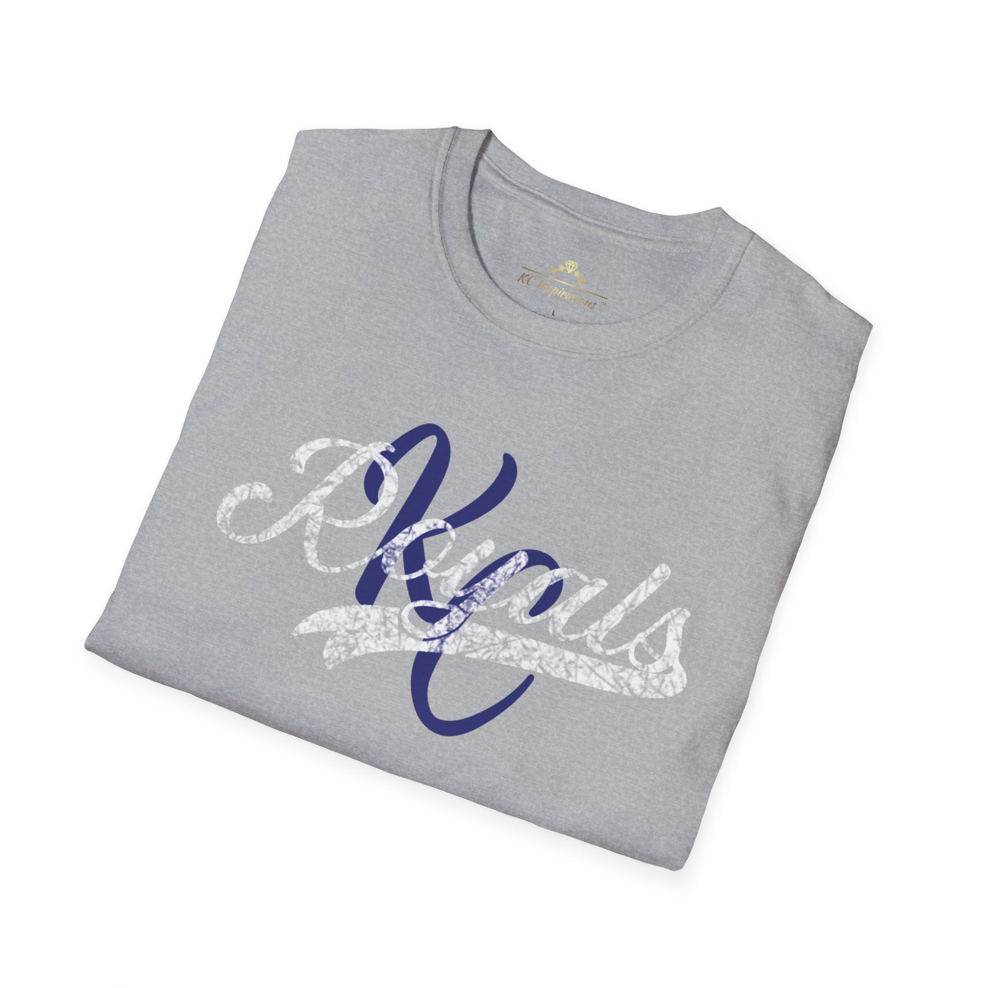 A gray vintage t-shirt featuring the word "Royals" in distressed graphics, written in a decorative script font across the chest in white and dark blue lettering. The short-sleeved Royal KC Semi Distressed - Kansas City Royals Inspired T-Shirt by KC Inspirations is displayed against a plain white background.