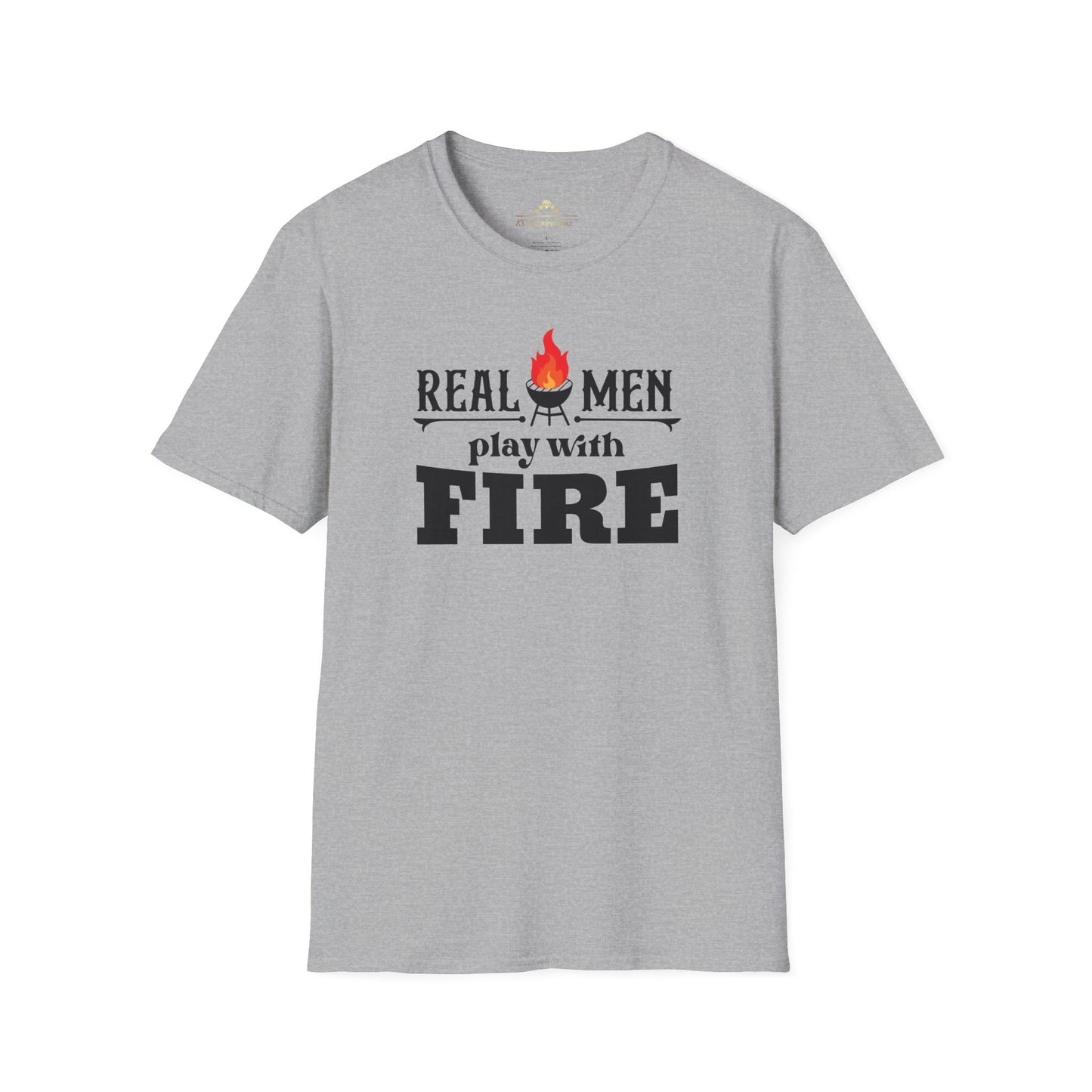 A gray-green Real Men Play With Fire - K.C. BBQ Inspired T-Shirt, featuring bold black letters and a flame icon above the "i" in "fire," is made from breathable lightweight fabric. Perfect for a casual ensemble, this shirt by KC Inspirations is displayed on a plain white background.