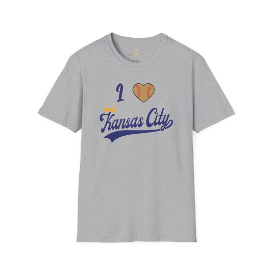 A light gray "I Heart Kansas City - Kansas City Royals Inspired T-Shirt" by KC Inspirations showcases team spirit with the text "I (heart) Kansas City" in blue script, where the heart is designed to resemble a baseball. Positioned across the chest, this Kansas City Royals-inspired design lays flat against a white background.