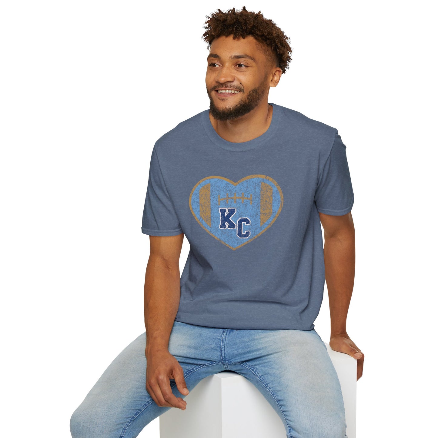 Blue short-sleeve t-shirt featuring a large Kansas City Royals heart graphic on the chest. Inside the heart are the letters "KC" set against a baseball-inspired background, perfect for showing off your Royals fandom. The shirt maintains a simple crew neck style. This is the Vintage KC Heart Blue & Gold - Kansas City Royals Inspired T-Shirt by KC Inspirations.