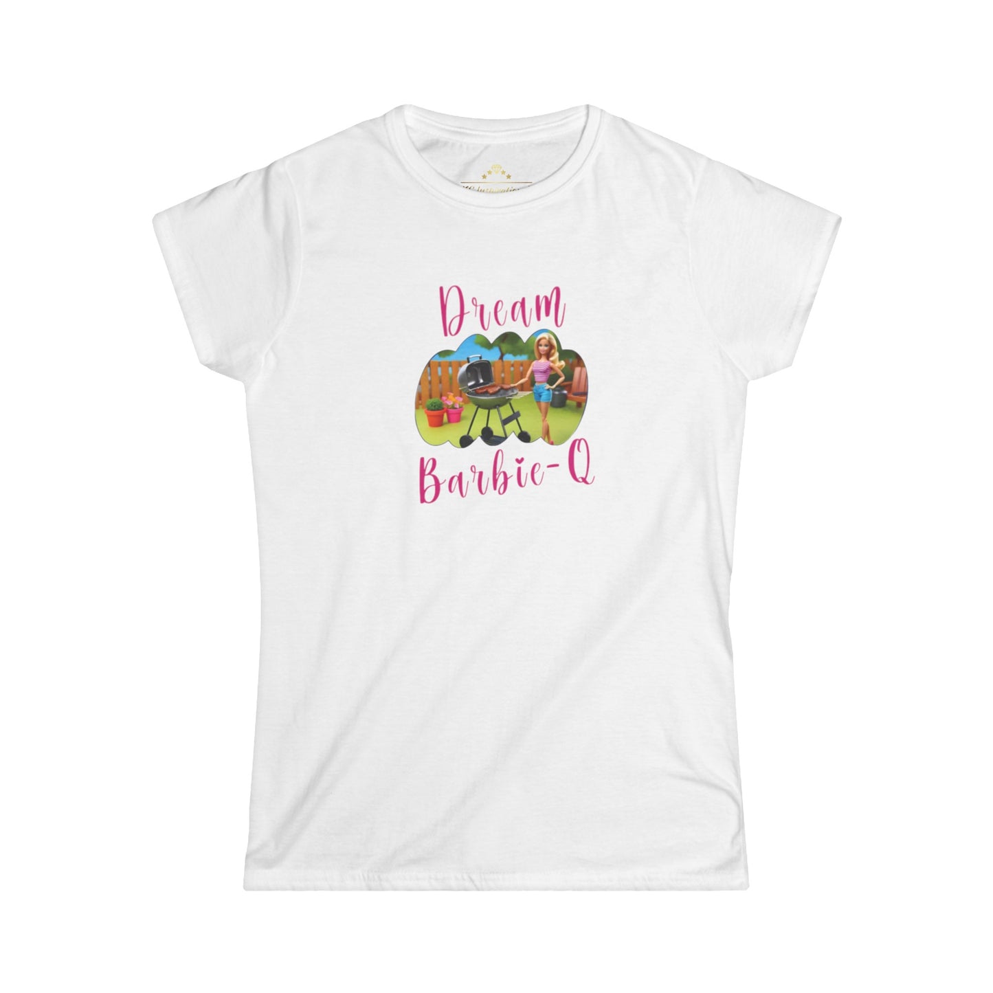 This Dream Barbie-Q - K.C. BBQ Inspired Women's T-Shirt by KC Inspirations is a light blue T-shirt featuring an illustration of a girl beside a grill with food, set against a playful outdoor background. Above the image, "Dream" is written in colorful letters and below it, "Barbie-Q" in whimsical pink font—perfect for fans of Kansas City BBQ.