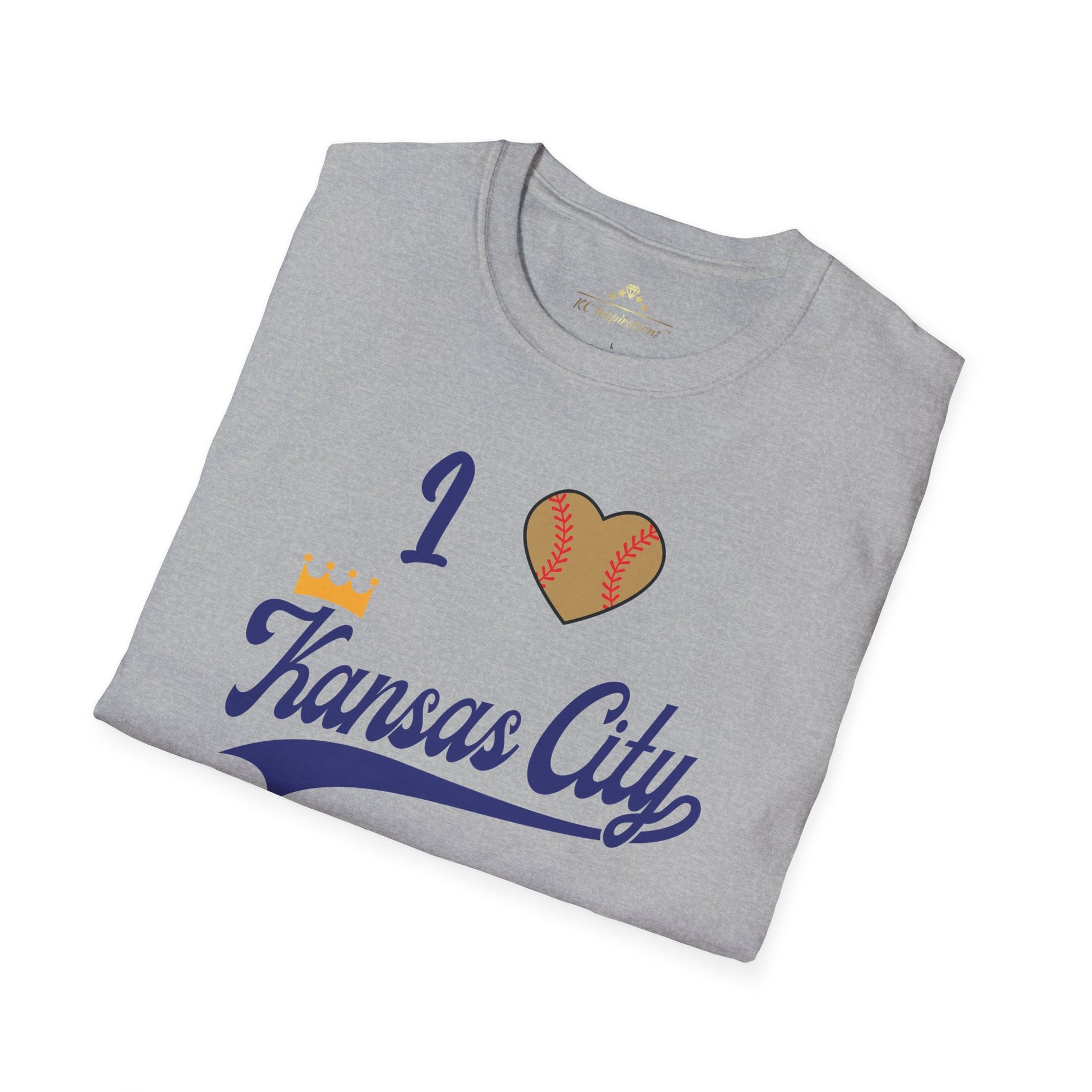 A light gray "I Heart Kansas City - Kansas City Royals Inspired T-Shirt" by KC Inspirations showcases team spirit with the text "I (heart) Kansas City" in blue script, where the heart is designed to resemble a baseball. Positioned across the chest, this Kansas City Royals-inspired design lays flat against a white background.