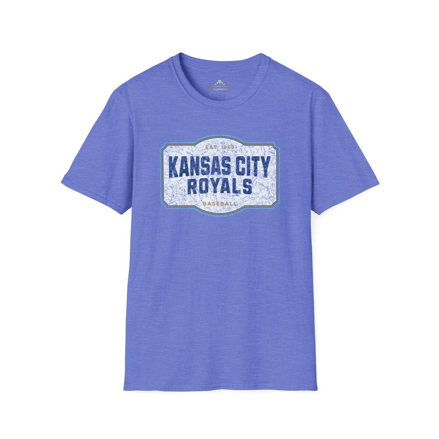 A light blue T-shirt with a graphic label in the center displaying "Kansas City Royals Baseball" in bold blue letters. The text "Est. 1969" is shown above the main text, giving it a vintage throwback look. Perfect for showing team spirit, this distressed T-shirt, Royal Badge - Kansas City Royals Inspired T-Shirt by KC Inspirations, is displayed on a white background.