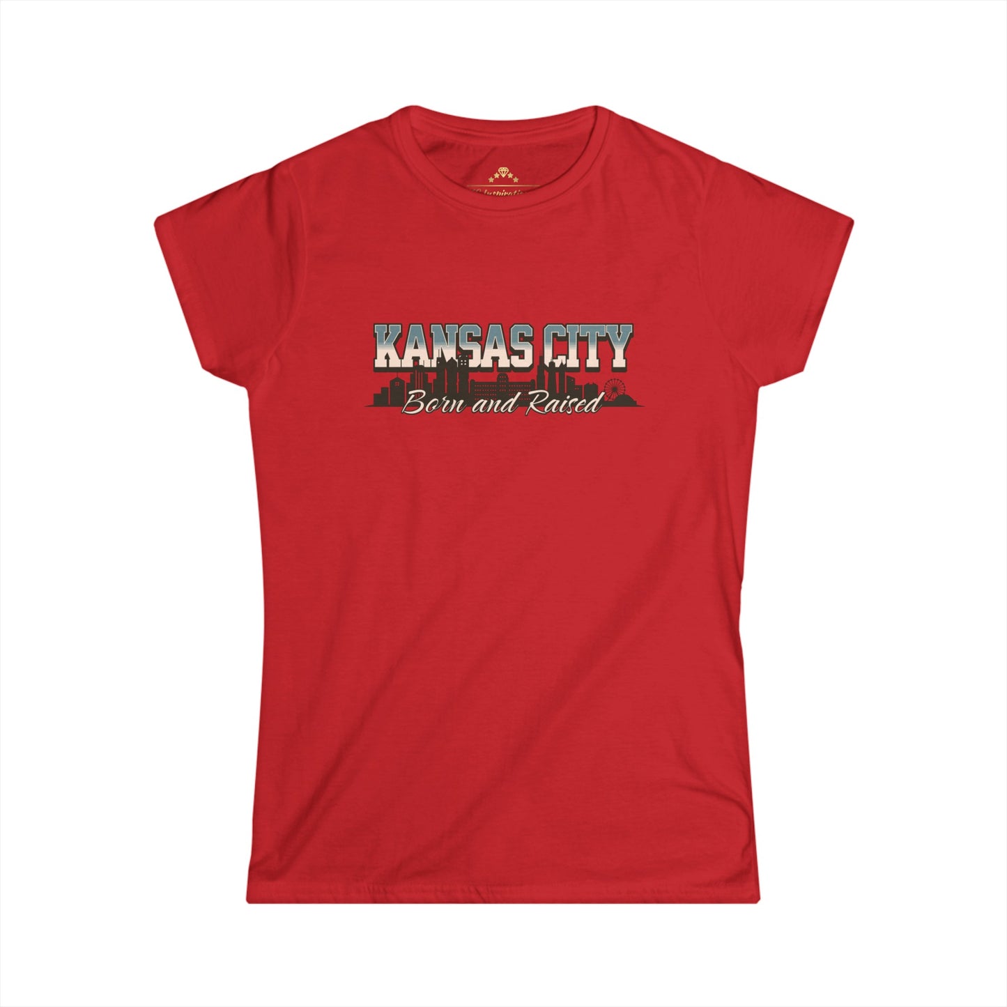 Light blue Born And Raised KC - Kansas City Inspired Women's T-Shirt by KC Inspirations with "KANSAS CITY Born and Raised" written on the front. The text features a city skyline silhouette integrated within the lettering, perfect for showing off your hometown pride.