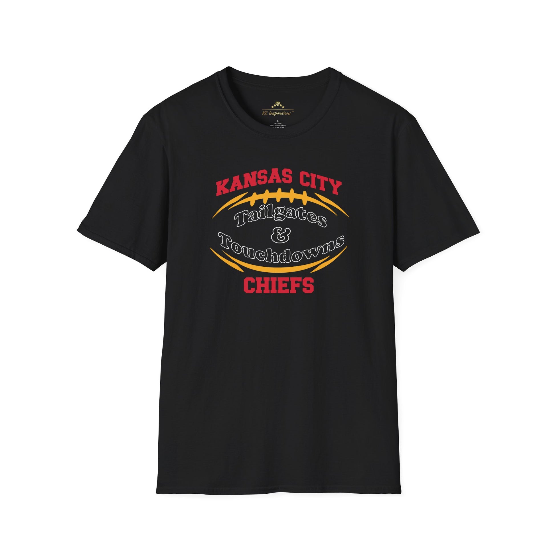 A dark gray Kansas City Chiefs t-shirt with "Kansas City Tailgates & Touchdowns Chiefs" written in bold red and yellow letters. The text is designed within the outline of a football, with "Chiefs" prominently featured at the bottom—perfect game day attire to show your team spirit. This is the **Tailgates & Touchdowns - Kansas City Chiefs Inspired T-Shirt** by **KC Inspirations**.