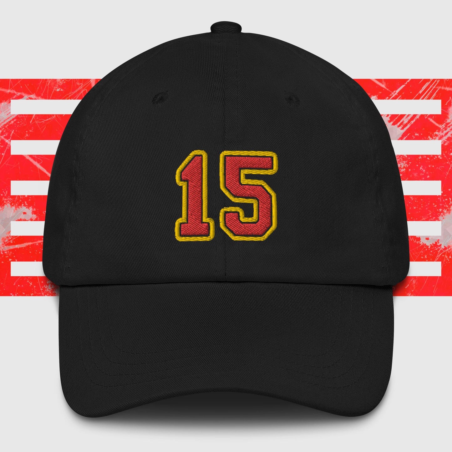 A black dad hat displays the number 15 in bold, yellow-outlined red embroidery on the front. The background features a graphic with vertical red and white stripes, paying homage to the Kansas City Chiefs. Introducing the Red & Gold 15 - Kansas City Chiefs Inspired Cap by KC Inspirations.