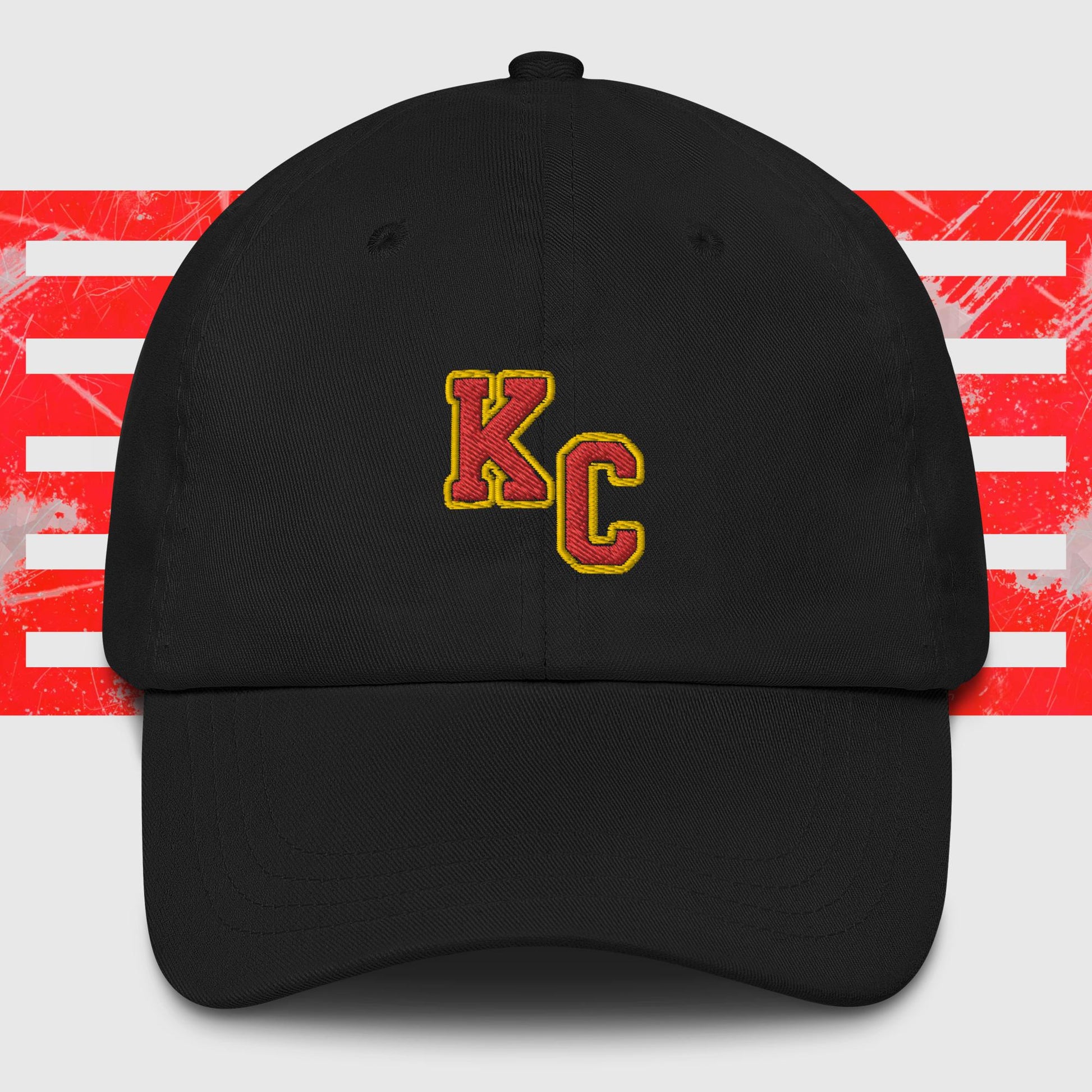 A KC Inspirations KC Red & Gold - Kansas City Chiefs Inspired Cap featuring the embroidered letters "KC" in red and yellow on the front. The background showcases red and white abstract stripes, making it a stylish choice for any Kansas City Chiefs fan.