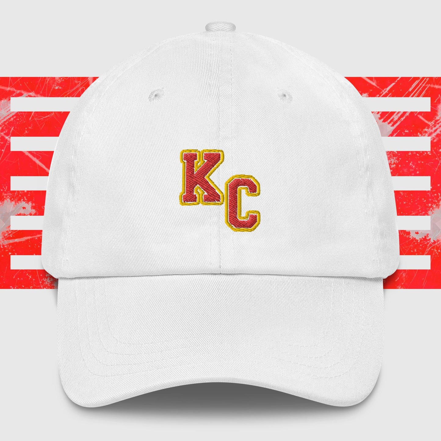 A KC Inspirations KC Red & Gold - Kansas City Chiefs Inspired Cap featuring the embroidered letters "KC" in red and yellow on the front. The background showcases red and white abstract stripes, making it a stylish choice for any Kansas City Chiefs fan.