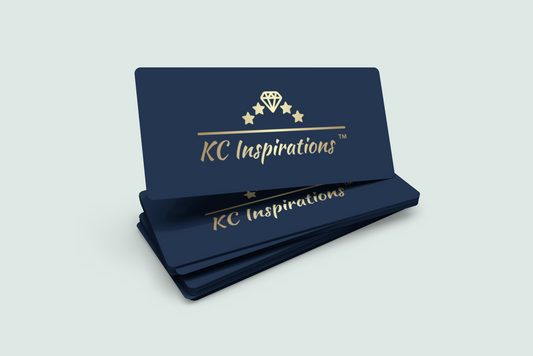 A stack of elegant digital gift cards with a navy blue background. The text "KC Inspirations™" is written in gold cursive on each card, accompanied by a gold diamond emblem and stars above the text. These unique high-quality products are neatly arranged against a light background.